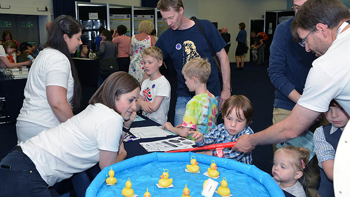 Families enjoying one of the activities at a public event.