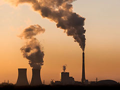 Image: Silhouette of industrial factory smoke stack of coal power plant .
