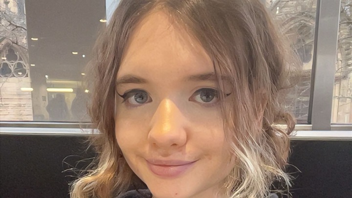 Student Anna Bulter is looking into the camera, smiling.