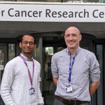 Dr Kiran Batta and Dr Dan Wiseman outside the Manchester Cancer Research Centre.