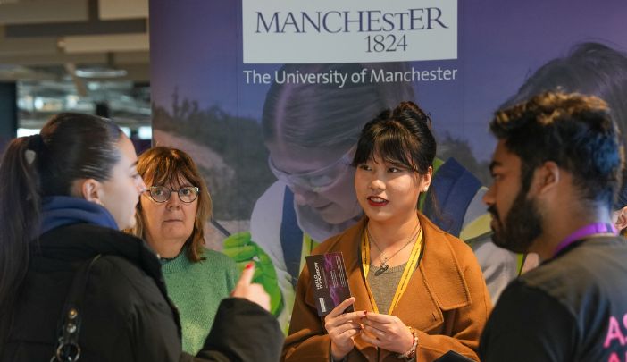 Postgraduate researchers sitting together having a coffee